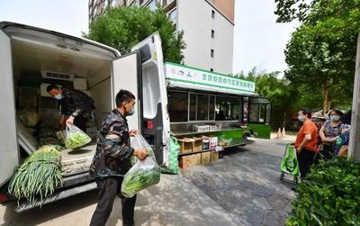 統(tǒng)一車身標(biāo)識(shí),“點(diǎn)對(duì)點(diǎn)”配送,300噸鮮菜直送社區(qū)